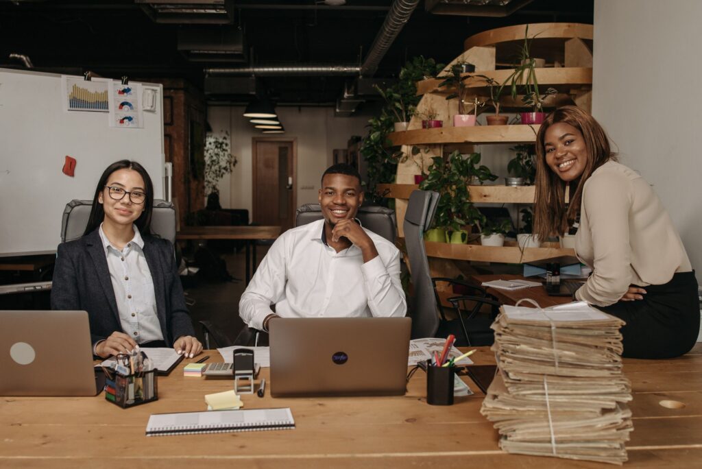 A diverse team of business professionals working together in a modern office setting.