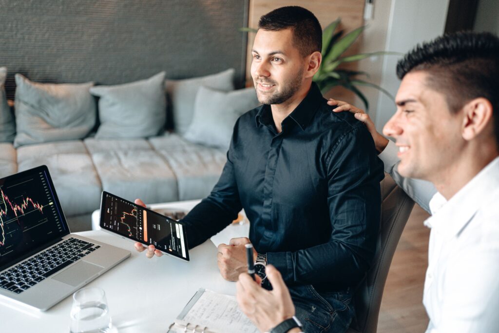 Two businessmen looking at a computer